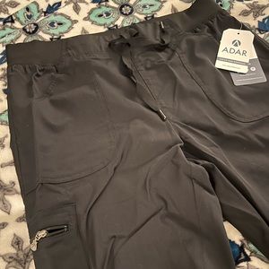 Black scrub pants never worn. They’re Large regular length joggers.